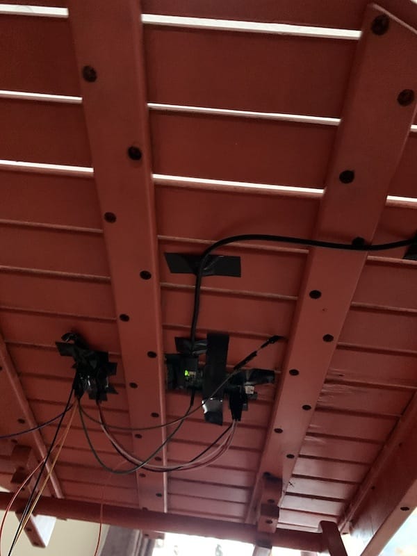 A photo showing the setup of wires underneath the table that the pumpkins sit on.